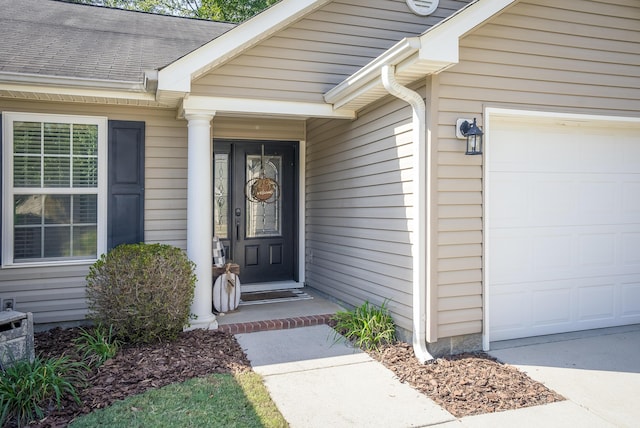 entrance to property featuring a garage