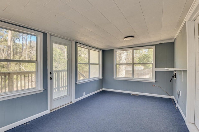 unfurnished sunroom featuring plenty of natural light