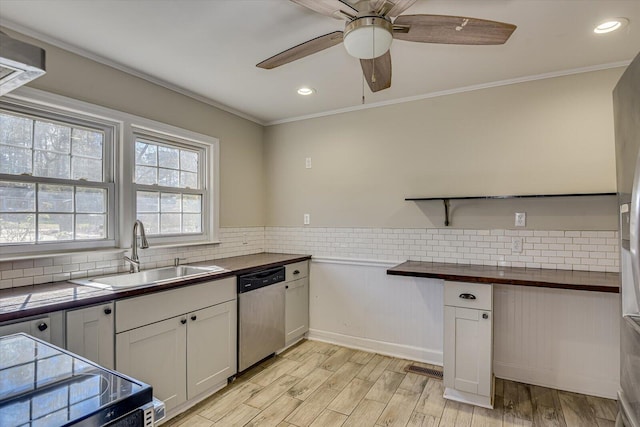 kitchen with white cabinetry, sink, stainless steel appliances, and light wood-type flooring