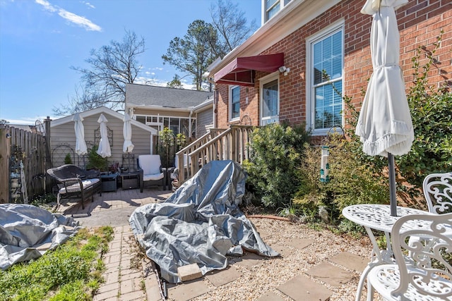 view of patio / terrace featuring fence and an outdoor hangout area