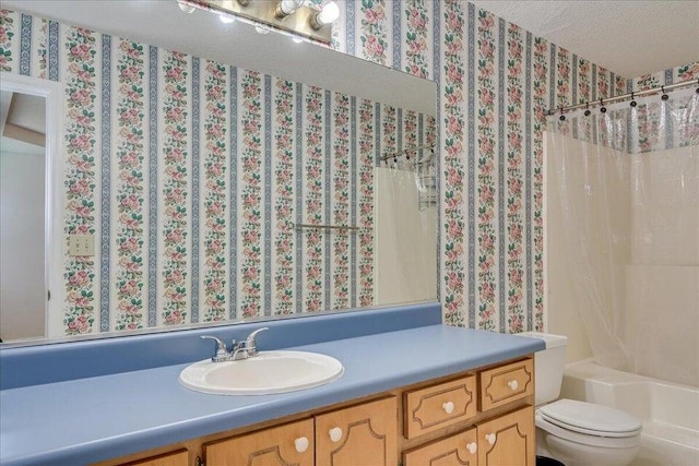 full bathroom with vanity, toilet, shower / bathtub combination with curtain, and a textured ceiling