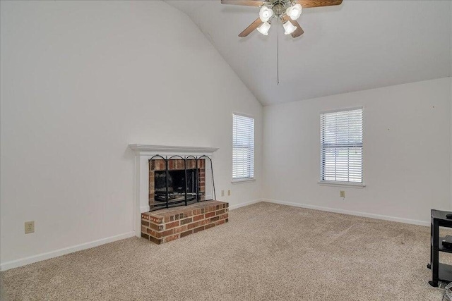 living room with light colored carpet, a brick fireplace, ceiling fan, and lofted ceiling