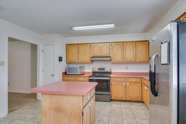 kitchen featuring a kitchen island, ornamental molding, a textured ceiling, and appliances with stainless steel finishes