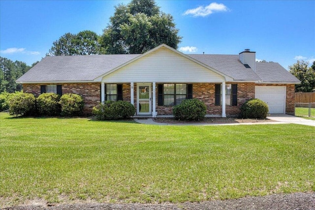 single story home featuring a garage and a front lawn