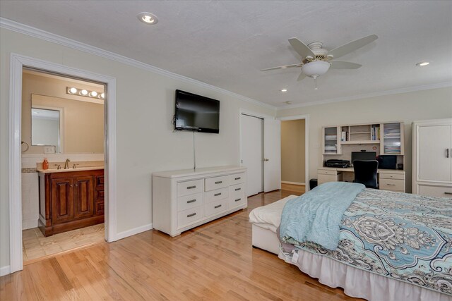 2408 Forest Park Rd, Augusta, GA 30904 - bedroom featuring a sink, light wood-style floors, ornamental molding, recessed lighting, and a desk
