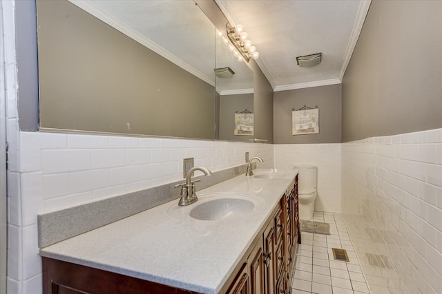 2408 Forest Park Rd, Augusta, GA 30904 - full bath with tile walls, double vanity, tile patterned flooring, crown molding, and toilet