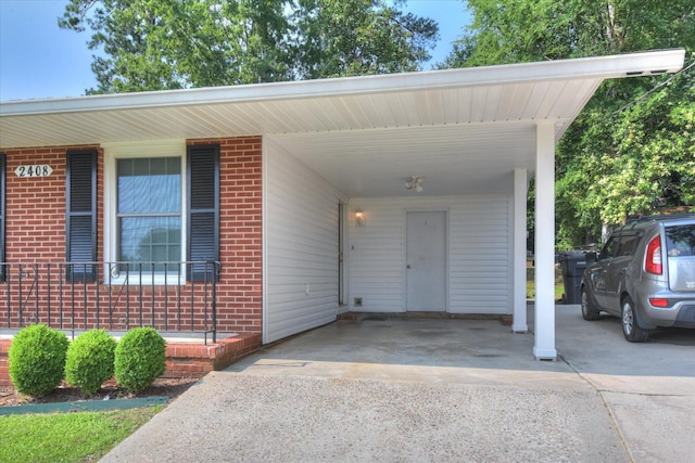 2408 Forest Park Rd, Augusta, GA 30904 - view of parking with concrete driveway and a carport