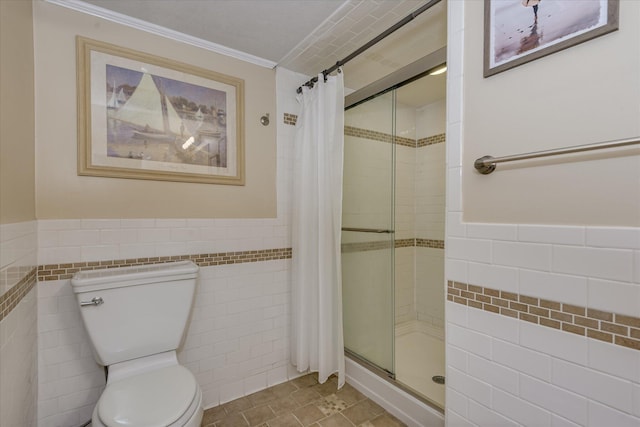 2408 Forest Park Rd, Augusta, GA 30904 - full bathroom featuring tile walls, toilet, a shower stall, wainscoting, and ornamental molding