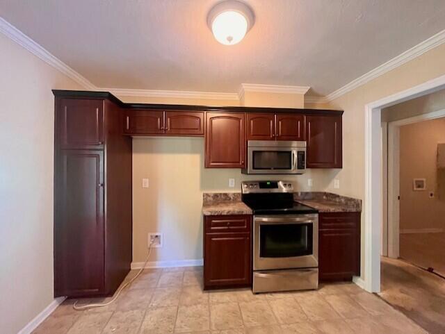 510 Lory Ln, Grovetown, GA 30813 - kitchen with appliances with stainless steel finishes, ornamental molding, and baseboards