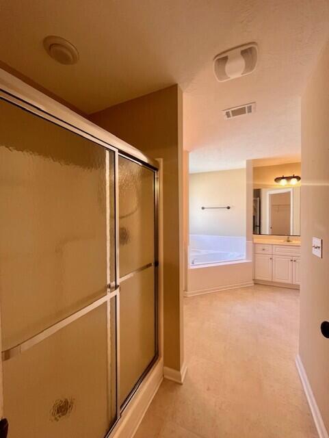 510 Lory Ln, Grovetown, GA 30813 - bathroom with an enclosed shower, baseboards, vanity, and tile patterned floors