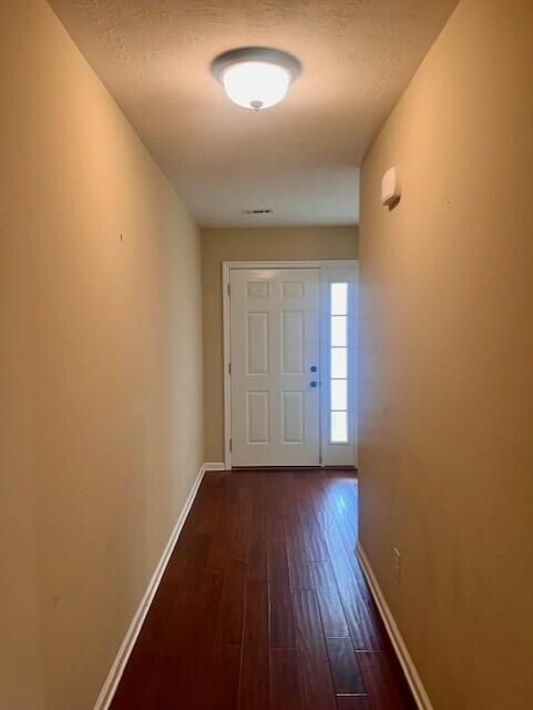 510 Lory Ln, Grovetown, GA 30813 - doorway with dark wood-type flooring and baseboards