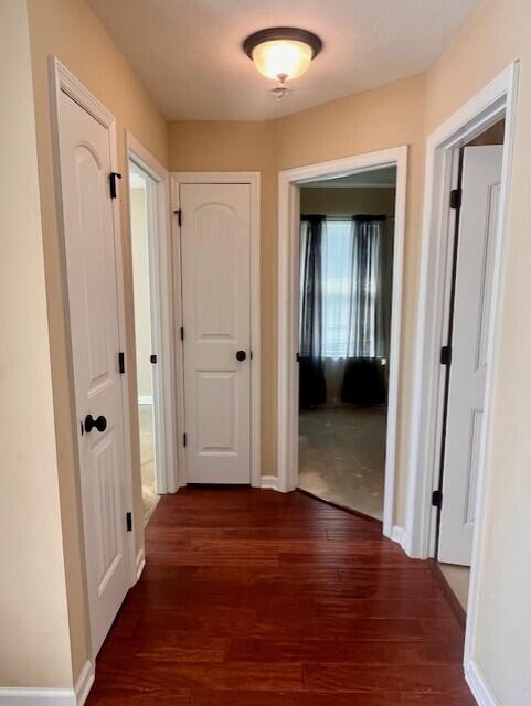 510 Lory Ln, Grovetown, GA 30813 - hallway with dark wood finished floors and baseboards