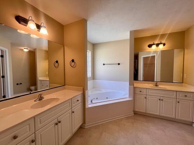 510 Lory Ln, Grovetown, GA 30813 - full bathroom with two vanities, a tub with jets, and toilet