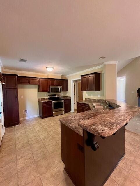 510 Lory Ln, Grovetown, GA 30813 - kitchen with stainless steel appliances, a sink, a peninsula, crown molding, and dark brown cabinets