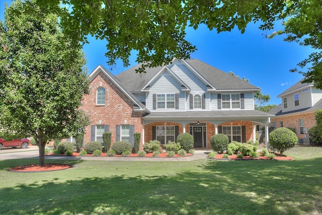 5193 Windmill Pl, Evans, GA 30809 - view of front of property featuring a front lawn, brick siding, and roof with shingles