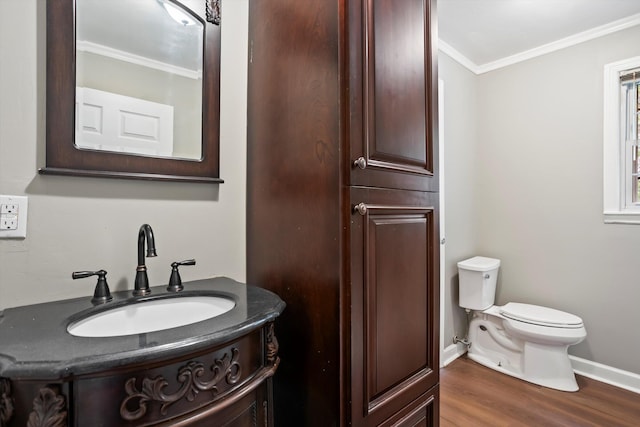 2901 Sussex Rd, Augusta, GA 30904 - bathroom featuring crown molding, toilet, vanity, wood finished floors, and baseboards