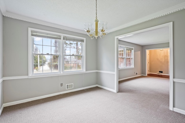 2901 Sussex Rd, Augusta, GA 30904 - spare room featuring a chandelier, healthy amount of natural light, carpet flooring, a textured ceiling, and baseboards