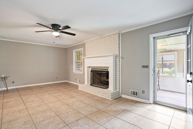 2901 Sussex Rd, Augusta, GA 30904 - unfurnished living room featuring light tile patterned floors, a ceiling fan, healthy amount of natural light, crown molding, and a fireplace