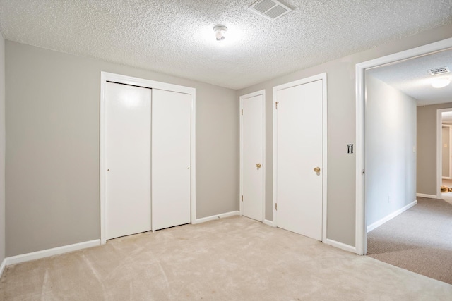 2901 Sussex Rd, Augusta, GA 30904 - unfurnished bedroom with light colored carpet, a textured ceiling, a closet, and baseboards