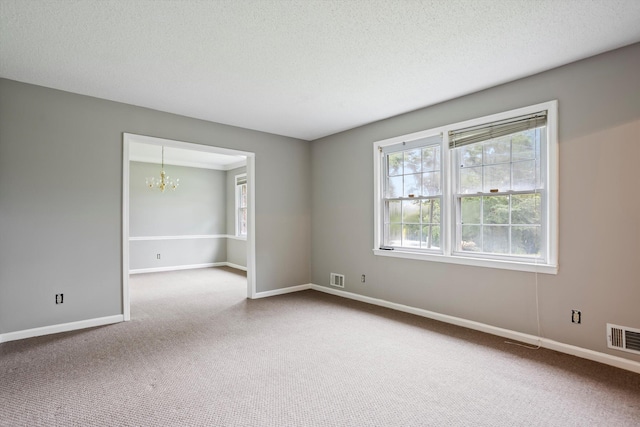 2901 Sussex Rd, Augusta, GA 30904 - unfurnished room with a chandelier, carpet flooring, baseboards, and a textured ceiling