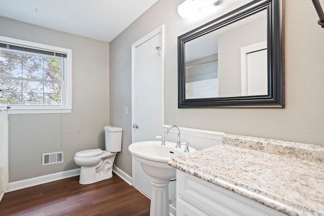 2901 Sussex Rd, Augusta, GA 30904 - bathroom featuring wood finished floors, toilet, and baseboards