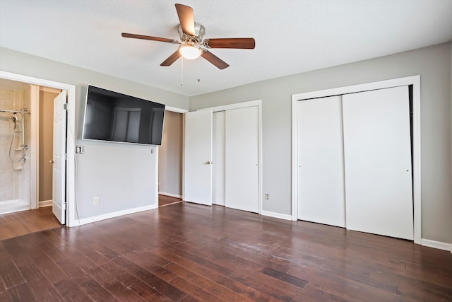 2901 Sussex Rd, Augusta, GA 30904 - unfurnished bedroom with multiple closets, wood finished floors, baseboards, ceiling fan, and ensuite bath