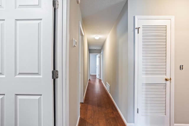 2901 Sussex Rd, Augusta, GA 30904 - corridor featuring dark wood finished floors, baseboards, and a textured ceiling