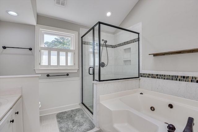 819 Cape Cod Ct, Evans, GA 30809 - bathroom with a jetted tub, a stall shower, vanity, recessed lighting, and vaulted ceiling