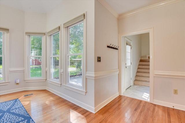 819 Cape Cod Ct, Evans, GA 30809 - entryway featuring light wood-style flooring, stairway, and crown molding