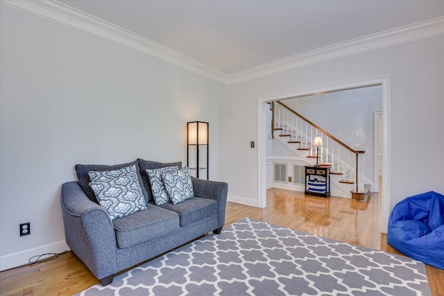 819 Cape Cod Ct, Evans, GA 30809 - living room featuring wood finished floors, stairs, and ornamental molding