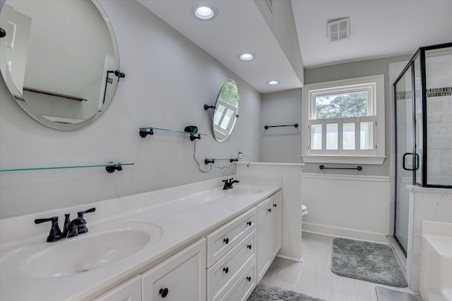 819 Cape Cod Ct, Evans, GA 30809 - full bathroom featuring a shower stall, double vanity, recessed lighting, and tile patterned flooring