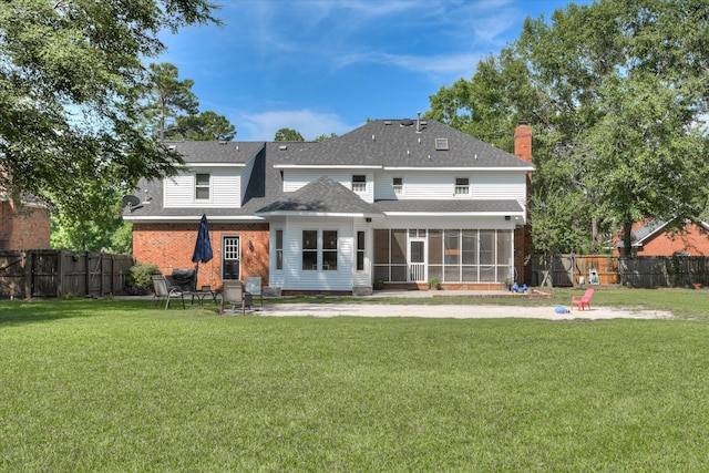 819 Cape Cod Ct, Evans, GA 30809 - rear view of property featuring a sunroom, roof with shingles, a fenced backyard, a patio, and a chimney