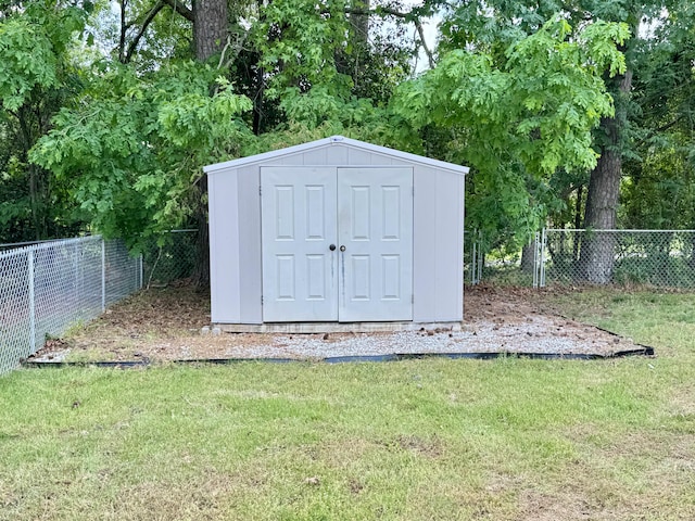 view of shed featuring fence