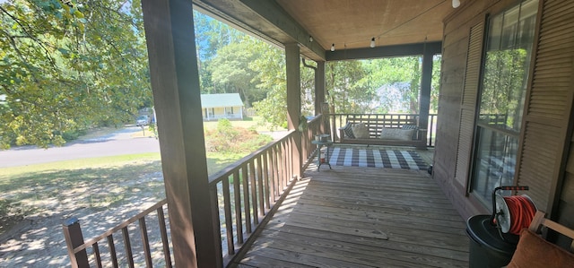 wooden deck featuring covered porch