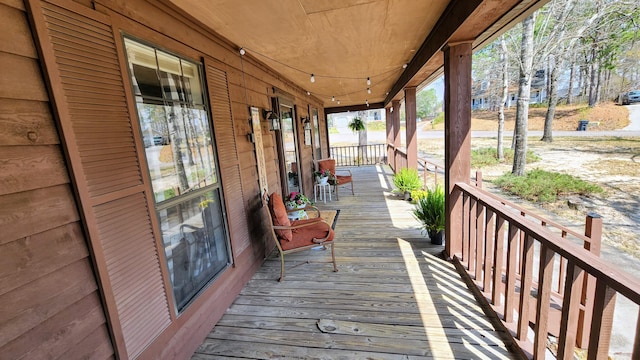 wooden terrace featuring a porch