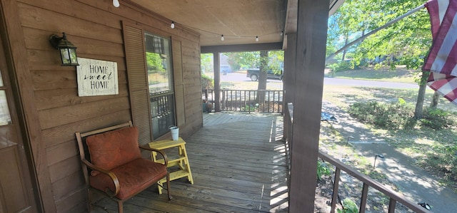 wooden terrace with a porch