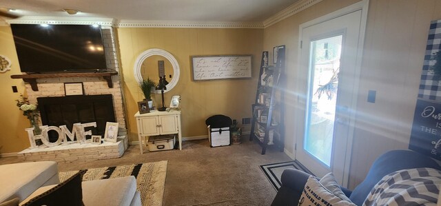 living room with baseboards, carpet, a fireplace, and crown molding