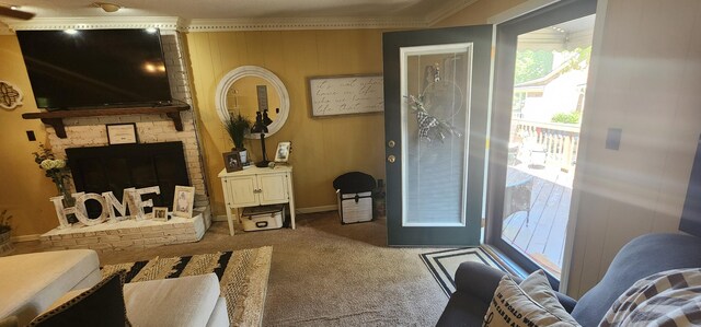 interior space with ornamental molding, a brick fireplace, and carpet floors