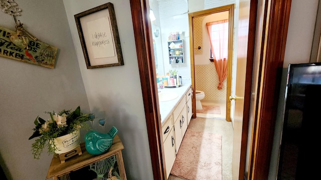 bathroom with vanity and toilet