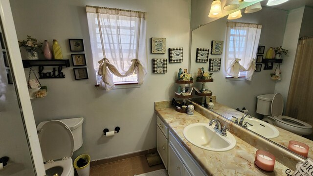 bathroom featuring toilet and tile patterned flooring