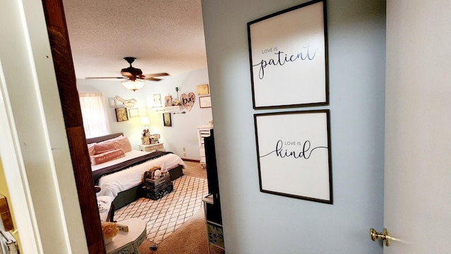 interior space featuring a textured ceiling and a ceiling fan