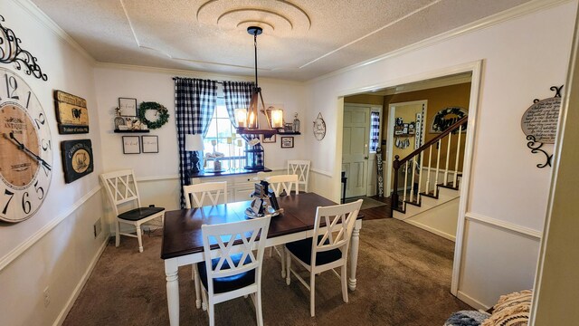 dining space with ornamental molding, a textured ceiling, dark carpet, stairway, and a chandelier