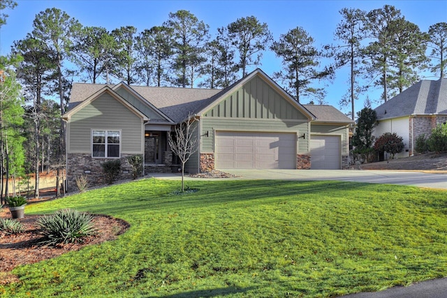 craftsman inspired home with a garage and a front lawn