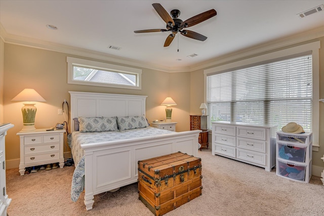 bedroom with light carpet, visible vents, and crown molding