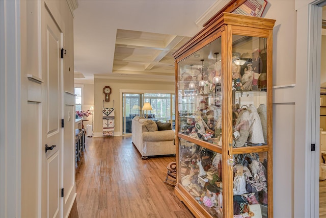 entrance foyer with baseboards, wood finished floors, beam ceiling, and coffered ceiling