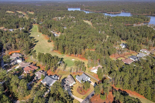 bird's eye view with golf course view, a forest view, a residential view, and a water view