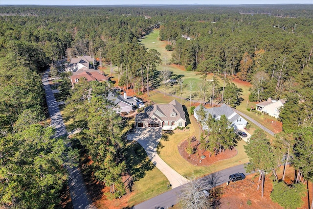 aerial view featuring a residential view and a forest view