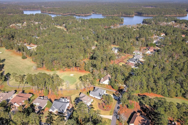 birds eye view of property with a water view, a residential view, and a wooded view