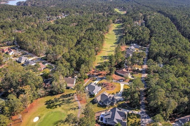 bird's eye view featuring a residential view, golf course view, and a wooded view