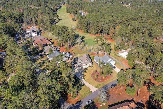 birds eye view of property featuring a residential view, a view of trees, and golf course view